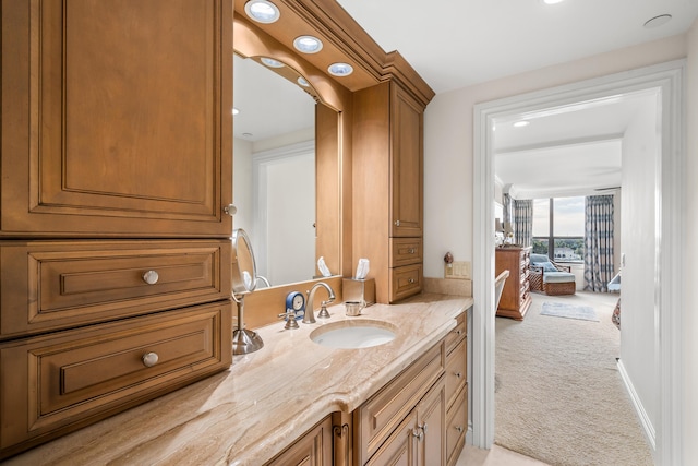 bathroom featuring vanity and floor to ceiling windows