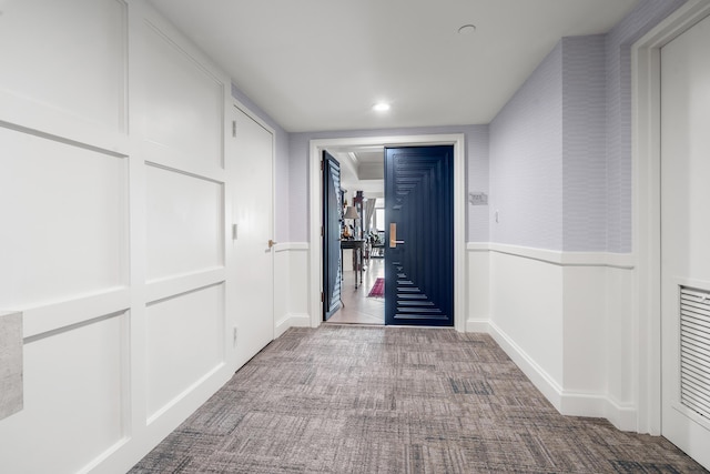 hallway with carpet floors