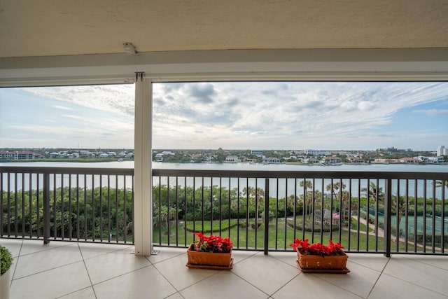 balcony featuring a water view