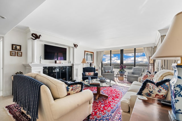 tiled living room featuring a high end fireplace, expansive windows, and ornamental molding