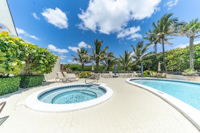 view of swimming pool with a patio