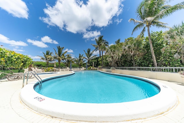 view of swimming pool featuring a patio