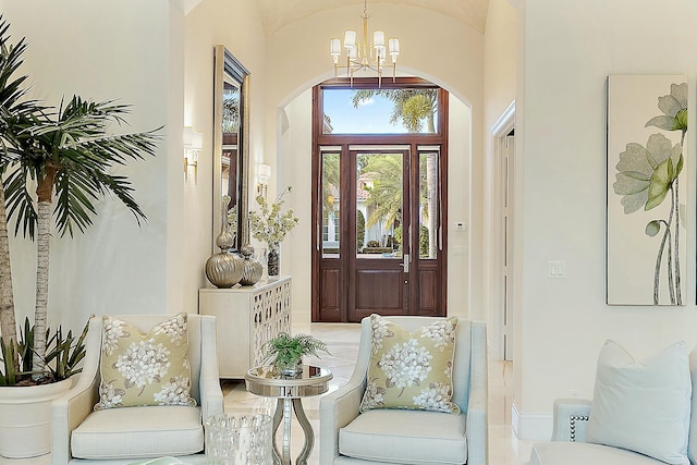 entrance foyer with a high ceiling and a chandelier