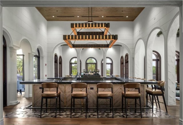 bar with wood ceiling and a towering ceiling