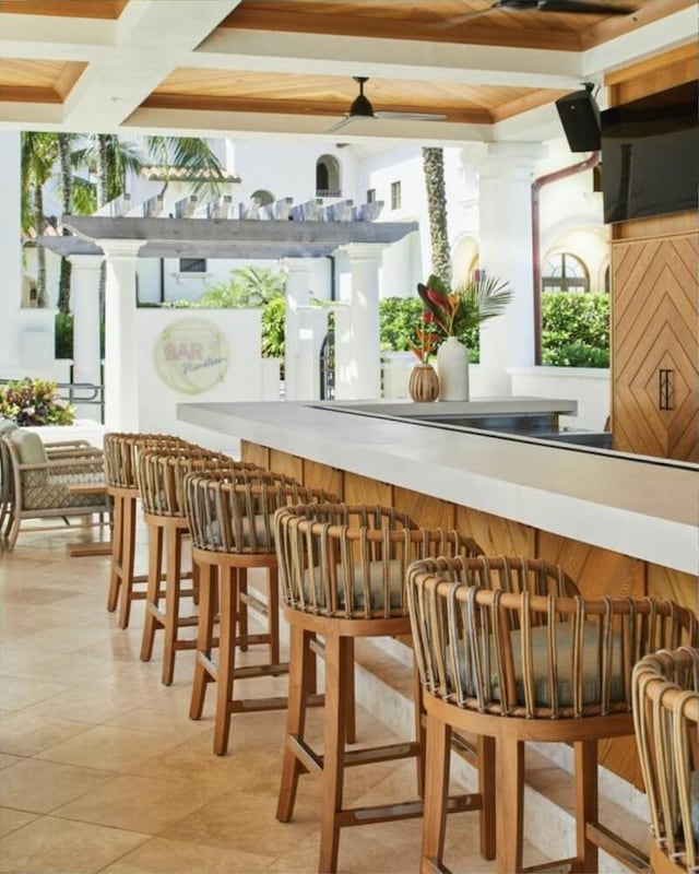 bar featuring light tile patterned floors