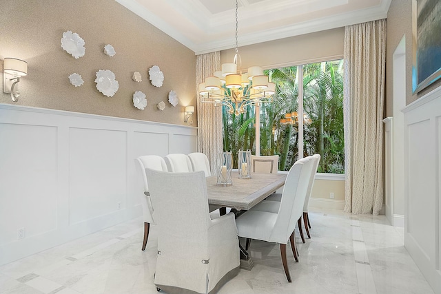 dining room featuring a notable chandelier and crown molding