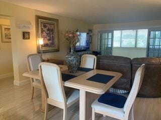 dining area with light hardwood / wood-style floors