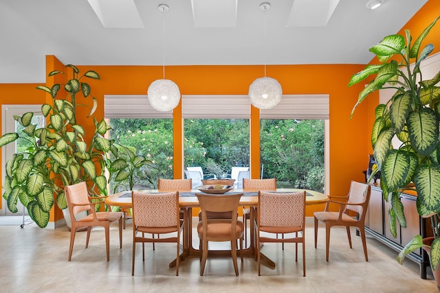 dining space featuring a skylight