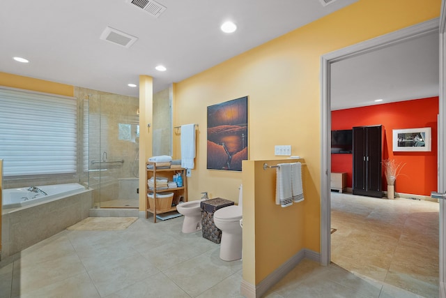 bathroom featuring tile patterned floors, toilet, a bidet, and separate shower and tub