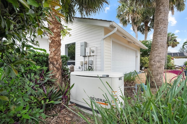 view of side of property featuring a garage