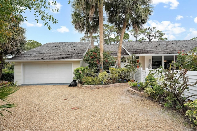 single story home with a garage