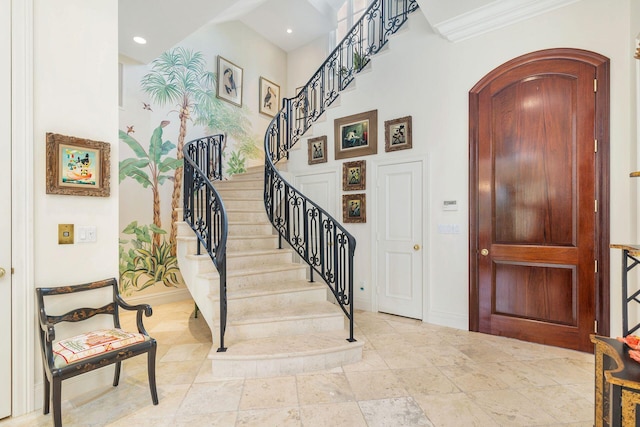 foyer featuring crown molding