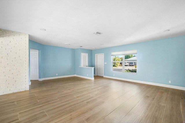 unfurnished living room with light wood-type flooring