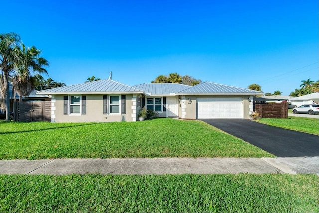 single story home with a front yard and a garage