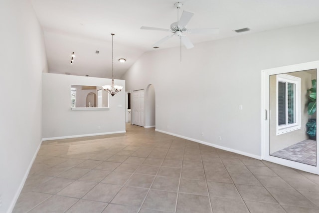 unfurnished living room featuring light tile patterned floors, lofted ceiling, and ceiling fan with notable chandelier