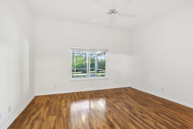 spare room featuring ceiling fan and dark hardwood / wood-style floors