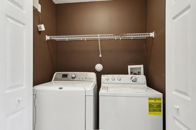 clothes washing area featuring washing machine and dryer