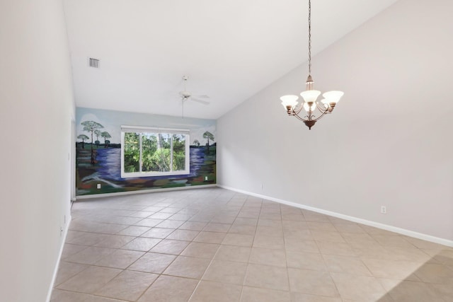 tiled empty room featuring vaulted ceiling and ceiling fan with notable chandelier