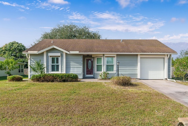 ranch-style home featuring a front lawn and a garage