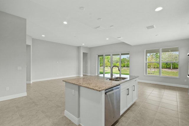 kitchen with dishwasher, sink, light stone counters, a kitchen island with sink, and white cabinets