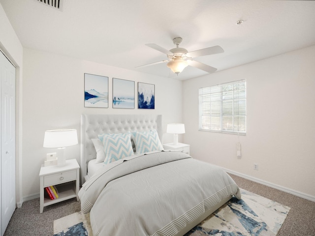 bedroom featuring ceiling fan, a closet, and carpet floors