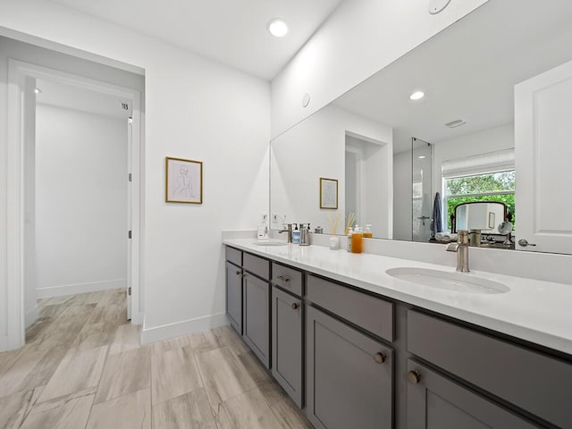 bathroom with vanity and an enclosed shower