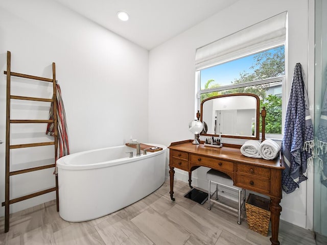 bathroom featuring a tub to relax in