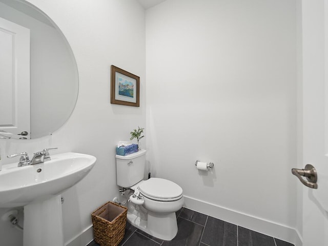 bathroom with toilet and sink