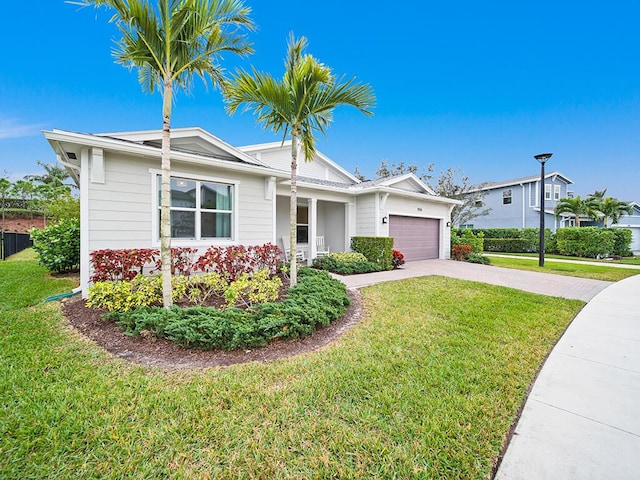 view of front facade featuring a front lawn and a garage