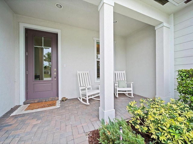 entrance to property featuring a porch