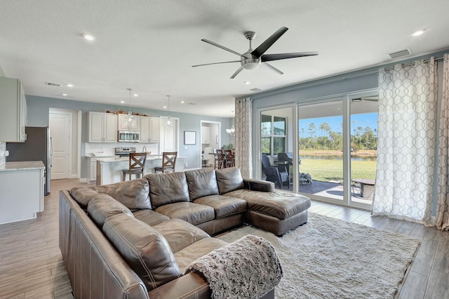 living room with ceiling fan