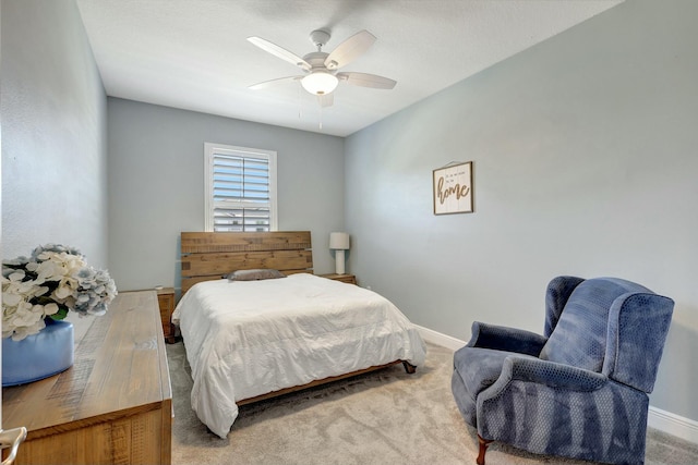 bedroom with light carpet and ceiling fan