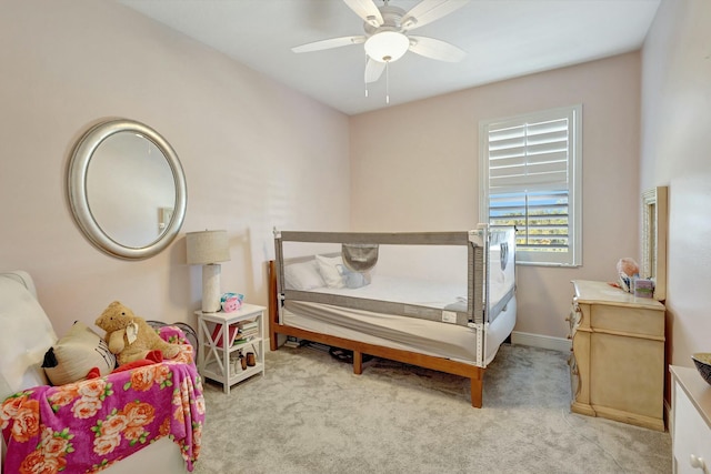 bedroom featuring ceiling fan and light colored carpet