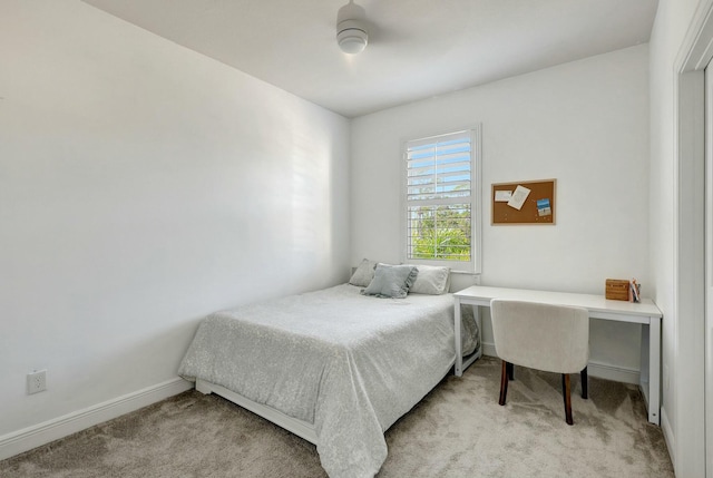 bedroom with light colored carpet