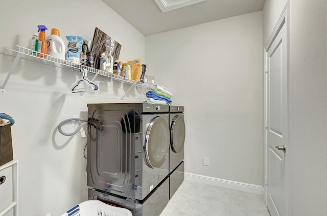 washroom featuring washer and dryer and ornamental molding