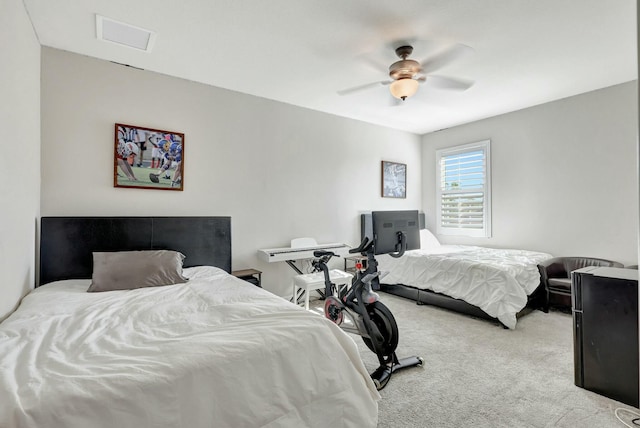 bedroom with ceiling fan and light colored carpet