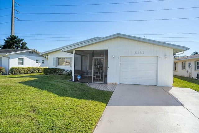 single story home featuring a front yard, a garage, and a sunroom