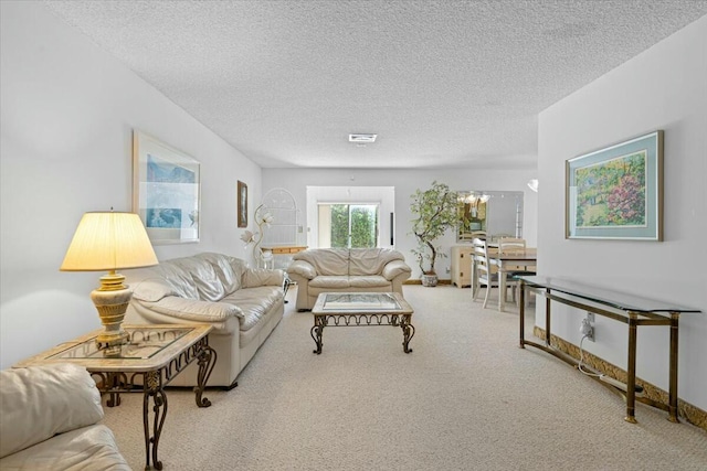 living room featuring carpet floors and a textured ceiling