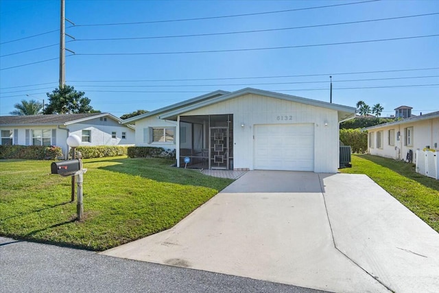 single story home with a sunroom and a front yard