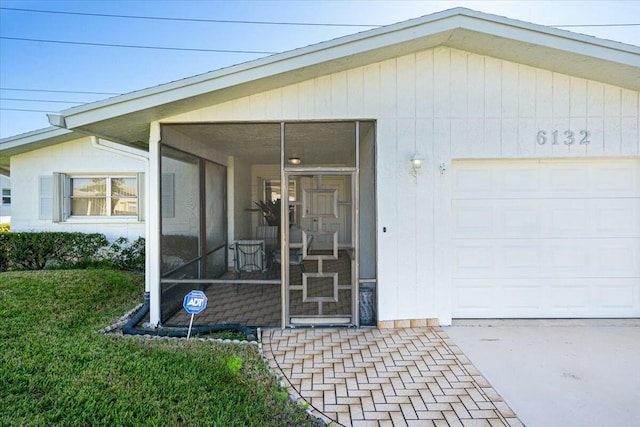 view of exterior entry featuring a garage