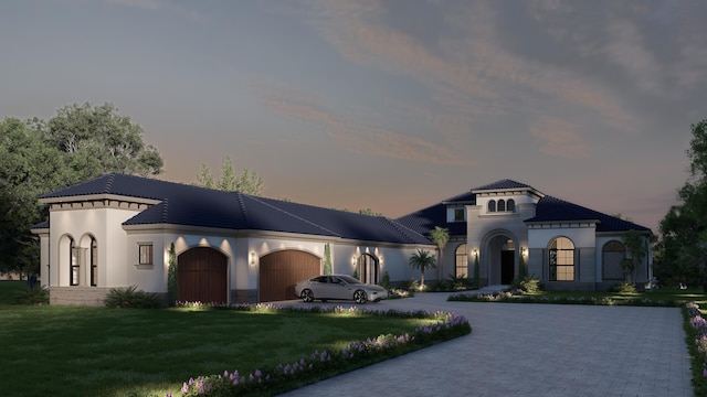 2861 SE S Lookout Blvd, Port Saint Lucie, FL 34984 - mediterranean / spanish-style house with decorative driveway, a lawn, an attached garage, and stucco siding