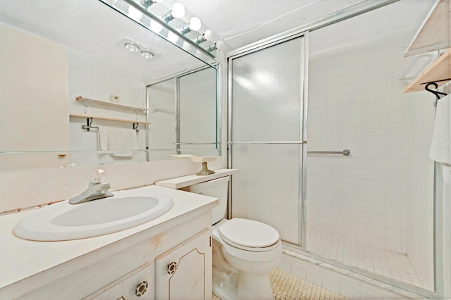 bathroom with tile patterned floors, vanity, toilet, and walk in shower