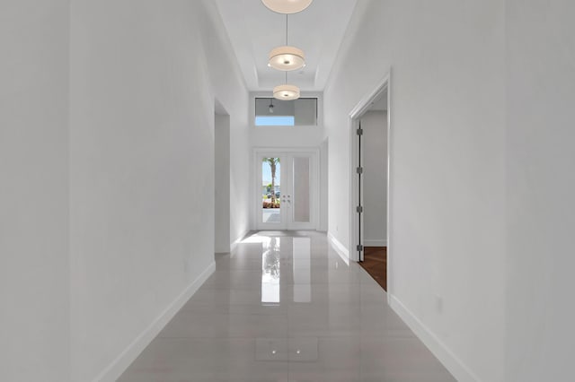 corridor with dark tile patterned flooring