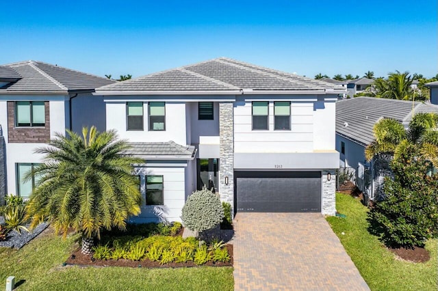 view of front of property with a garage