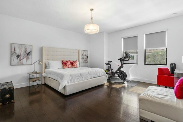 bedroom with dark wood-type flooring