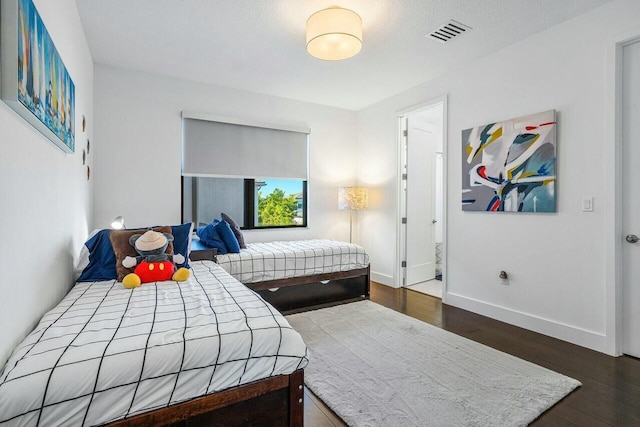 bedroom featuring dark hardwood / wood-style floors