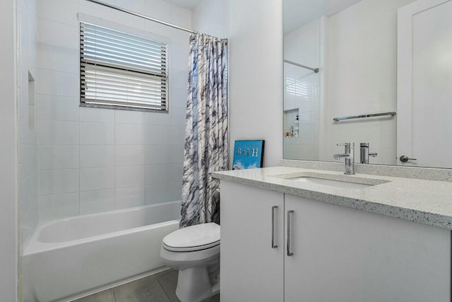 full bathroom featuring tile patterned flooring, vanity, toilet, and shower / bath combo with shower curtain