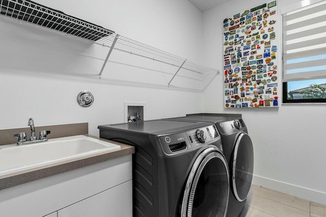 washroom featuring washing machine and clothes dryer and sink