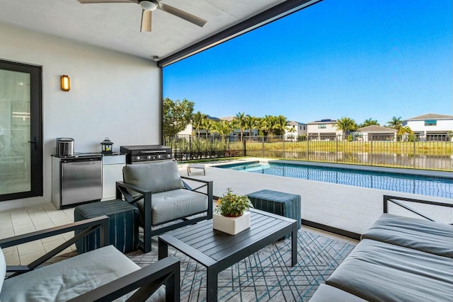 view of swimming pool with a grill and ceiling fan