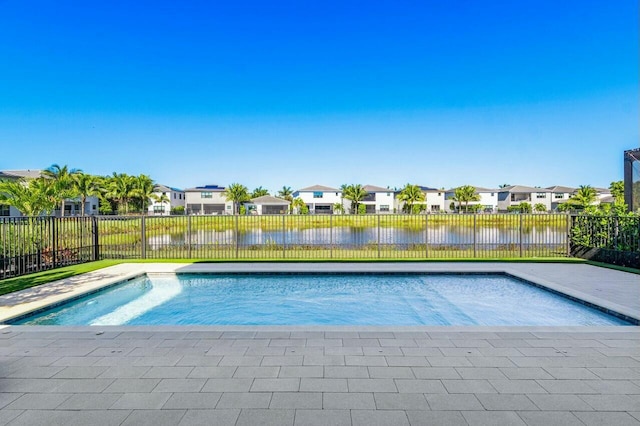 view of pool with a water view